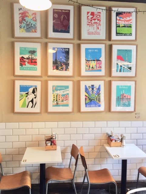 Art and table at Cafe Brown and Green in Crystal Palace London England